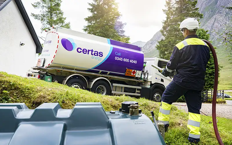 Certas Energy truck delivering heating oil to a home.